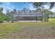 Large, refreshing pool with a screened enclosure at 955 N Ridgewood Ave, Deland, FL 32720
