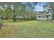 Charming backyard with a detached shed and lush green space at 955 N Ridgewood Ave, Deland, FL 32720