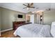 Main bedroom with wood floors, ceiling fan, and large window at 1448 Galena Ter, Deltona, FL 32725