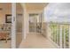 Condo balcony with sliding glass doors and partial living room view at 3 Oceans West Blvd # 4A5, Daytona Beach Shores, FL 32118