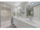 Double vanity bathroom with updated fixtures and mirror at 3 Oceans West Blvd # 4A5, Daytona Beach Shores, FL 32118