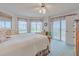 Primary bedroom with private balcony access and water views at 3 Oceans West Blvd # 4A5, Daytona Beach Shores, FL 32118