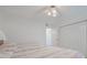 Bright bedroom featuring two twin beds and ample closet space at 3 Oceans West Blvd # 4A5, Daytona Beach Shores, FL 32118