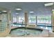 Relaxing indoor pool and hot tub area at 3 Oceans West Blvd # 4A5, Daytona Beach Shores, FL 32118