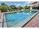 Relaxing outdoor pool area with surrounding foliage at 3 Oceans West Blvd # 4A5, Daytona Beach Shores, FL 32118