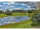 Serene pond reflecting clouds, near a golf course at 3 Oceans West Blvd # 4A5, Daytona Beach Shores, FL 32118