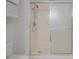 Walk-in shower with grab bars and tiled walls at 3 Oceans West Blvd # 4A5, Daytona Beach Shores, FL 32118