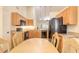 Kitchen dining area with wood table and chairs, and large window at 32543 Crystal Breeze Ln, Leesburg, FL 34788