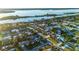 Aerial view of the property and surrounding waterfront community at 33 Sunny Beach Dr, Ormond Beach, FL 32176