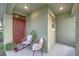 Inviting front porch with seating area and potted plants at 384 Lady Bella Pl, Deland, FL 32724