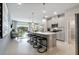 Modern kitchen with island, stainless steel appliances, and gray cabinetry at 4573 Small Creek Rd, Kissimmee, FL 34744