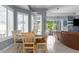 Bright breakfast nook with table and chairs near sliding doors at 3765 John Anderson Dr, Ormond Beach, FL 32176
