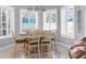 Breakfast nook with built-in seating and large windows at 3765 John Anderson Dr, Ormond Beach, FL 32176