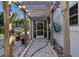 Brick pathway under a wooden pergola leading to the back of the house at 3765 John Anderson Dr, Ormond Beach, FL 32176