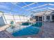 Resort-style pool and spa with a covered lanai and brick pavers at 3765 John Anderson Dr, Ormond Beach, FL 32176