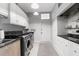 Laundry room with washer, dryer and built-in cabinets at 3765 John Anderson Dr, Ormond Beach, FL 32176