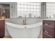 Relaxing bathroom with a large soaking tub and marble finishes at 3765 John Anderson Dr, Ormond Beach, FL 32176