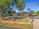 Stunning two-story home with lush landscaping and gated entrance at 3765 John Anderson Dr, Ormond Beach, FL 32176
