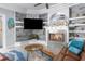 Spacious living room with fireplace and built-in shelving at 3765 John Anderson Dr, Ormond Beach, FL 32176