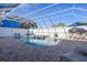 Inviting pool area with a covered lanai and plenty of space for relaxation at 3765 John Anderson Dr, Ormond Beach, FL 32176