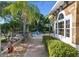 Brick pathway leads to outdoor patio area at 3765 John Anderson Dr, Ormond Beach, FL 32176