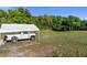 Large backyard with a covered truck and a shed at 3765 John Anderson Dr, Ormond Beach, FL 32176
