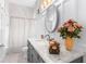 Bathroom with vanity, large mirror and shower at 3765 John Anderson Dr, Ormond Beach, FL 32176