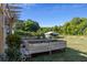 Spacious backyard with raised garden beds and a pergola at 3765 John Anderson Dr, Ormond Beach, FL 32176