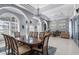 Elegant dining room featuring a large table and chandelier at 3765 John Anderson Dr, Ormond Beach, FL 32176