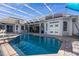 Stunning pool and spa with covered patio and ample seating at 3765 John Anderson Dr, Ormond Beach, FL 32176