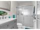 Bathroom boasts a vanity with a gray cabinet and a walk-in shower at 3765 John Anderson Dr, Ormond Beach, FL 32176