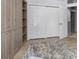 Spacious bedroom with built-in wooden closets and shelving at 3765 John Anderson Dr, Ormond Beach, FL 32176