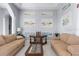 Comfortable sitting area with two sofas and gallery wall at 3765 John Anderson Dr, Ormond Beach, FL 32176
