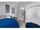 Comfortable bedroom with blue bedding and ample closet space at 3765 John Anderson Dr, Ormond Beach, FL 32176