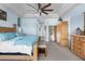 Bright main bedroom with large bed and built-in dresser at 3765 John Anderson Dr, Ormond Beach, FL 32176