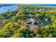 Waterfront home with solar panels and lush landscaping at 3765 John Anderson Dr, Ormond Beach, FL 32176
