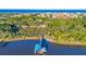 Private boat dock with covered area and two boats at 3765 John Anderson Dr, Ormond Beach, FL 32176