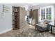 Multi-functional bedroom with built-in desk and seating area at 3765 John Anderson Dr, Ormond Beach, FL 32176