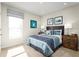 Bedroom with a blue and white comforter and penguin art at 1235 Tank Trl, Haines City, FL 33844