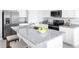 Modern kitchen island with granite countertop and seating at 1235 Tank Trl, Haines City, FL 33844