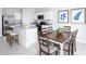 Bright dining area with a wood table and six chairs at 1235 Tank Trl, Haines City, FL 33844