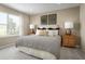 Bright bedroom with a king-size bed, hardwood floors, and natural light at 3022 Ruby Falls Dr, Deland, FL 32724