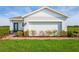 One-story home with light blue siding and brick walkway at 3022 Ruby Falls Dr, Deland, FL 32724