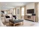 Open living area with a comfortable seating arrangement and large TV at 3022 Ruby Falls Dr, Deland, FL 32724