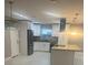 Modern kitchen with island and stainless steel appliances at 3062 Rio Ln, Orlando, FL 32805