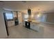 Modern kitchen with white cabinets, granite island, and stainless steel appliances at 3062 Rio Ln, Orlando, FL 32805