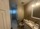 Updated bathroom features a vanity with granite countertop and a walk-in shower at 3062 Rio Ln, Orlando, FL 32805