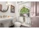 Charming bathroom with pedestal sink and window at 4920 Sw 78Th Ave, Bushnell, FL 33513