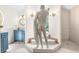 Bathroom with blue vanity, a large mirror and a statue at 4920 Sw 78Th Ave, Bushnell, FL 33513