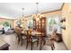 Bright dining room with hardwood floors and large windows at 4920 Sw 78Th Ave, Bushnell, FL 33513